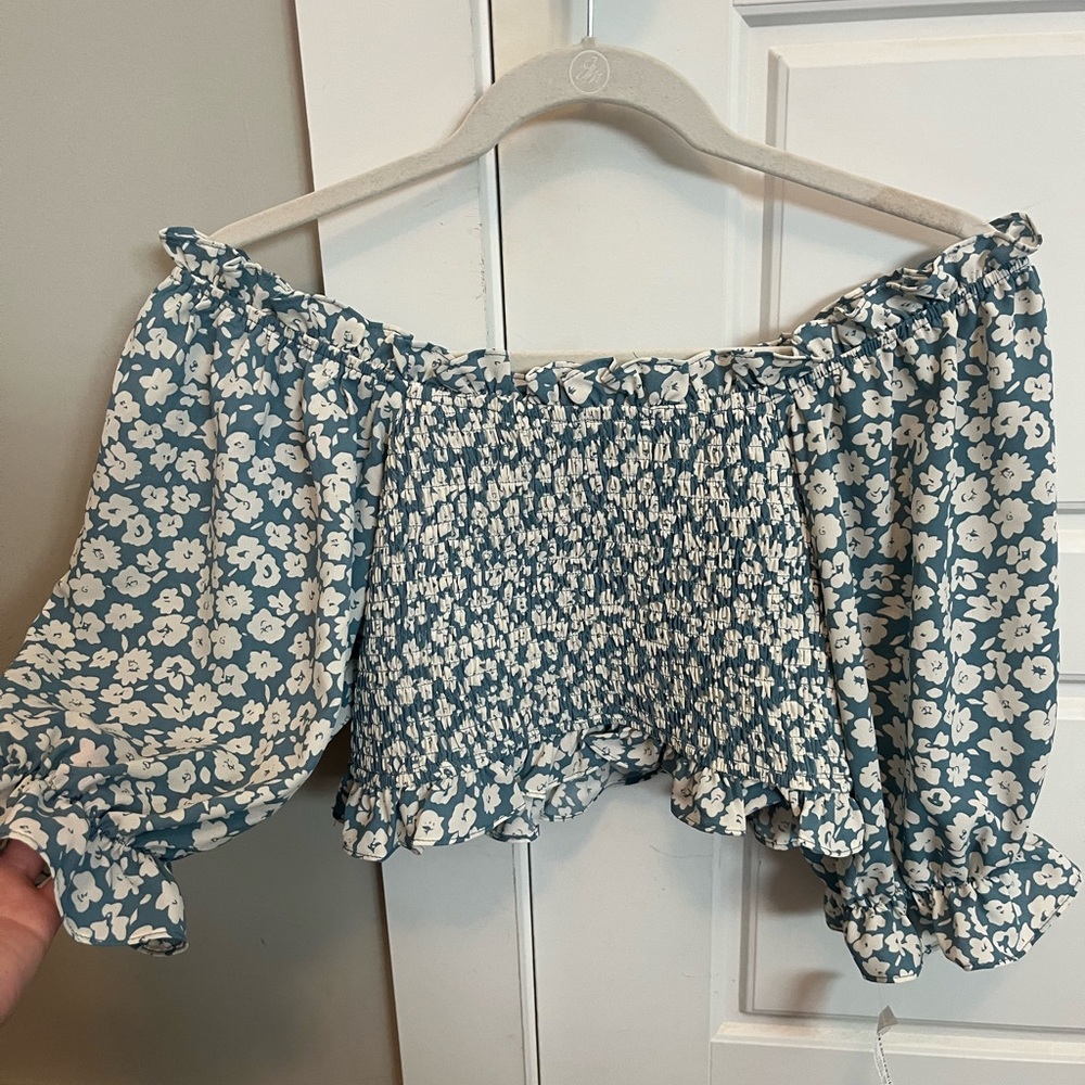 Blue floral smocked top. Can be worn off the shoulder or on.